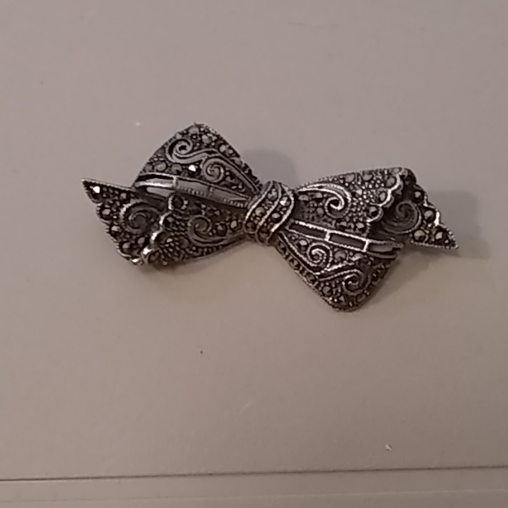 Marcasite and silver brooch bow design